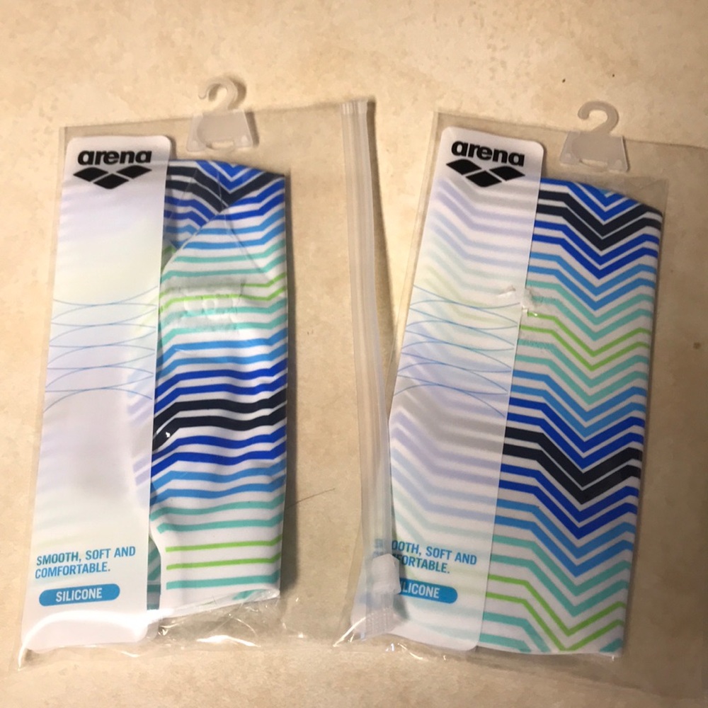 Two Arena brand Swim Caps